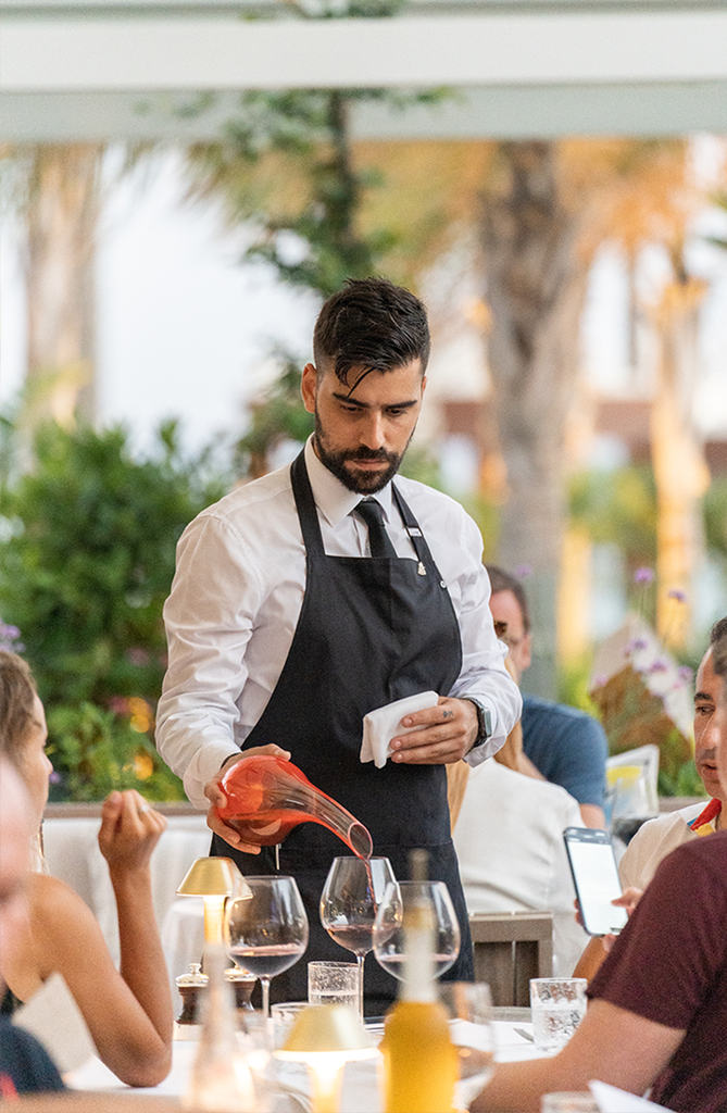 person pouring drink